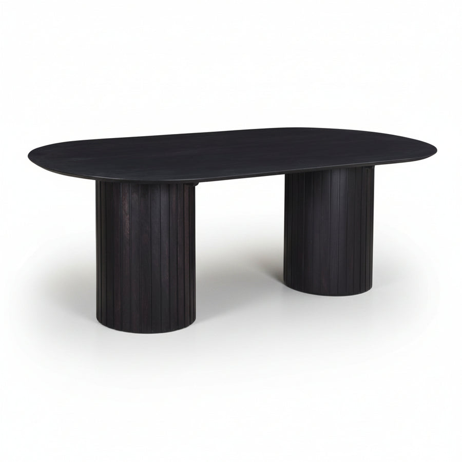 modern black wooden oval table with ribbed cylindrical legs on a white background