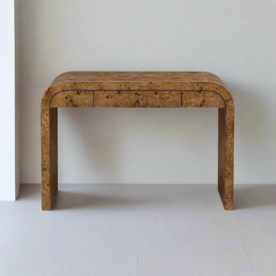 Wooden console table with a single drawer on a white background