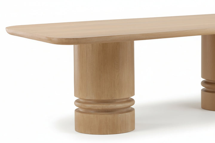 Wooden table with a cylindrical base on a white background