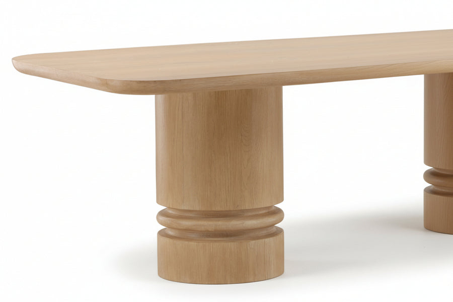Wooden table with a cylindrical base on a white background
