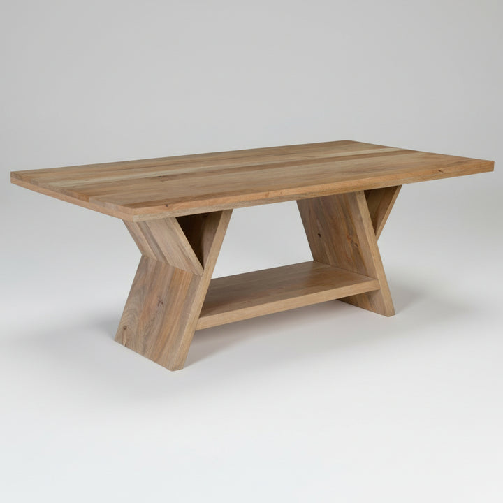 Wooden dining table with unique X-shaped legs on a white background