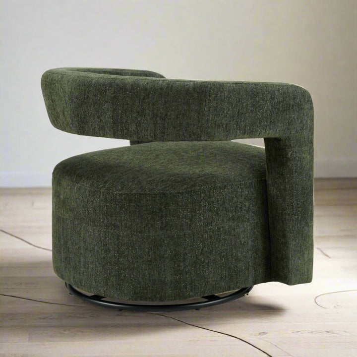 Green upholstered chair with a round base on a white background