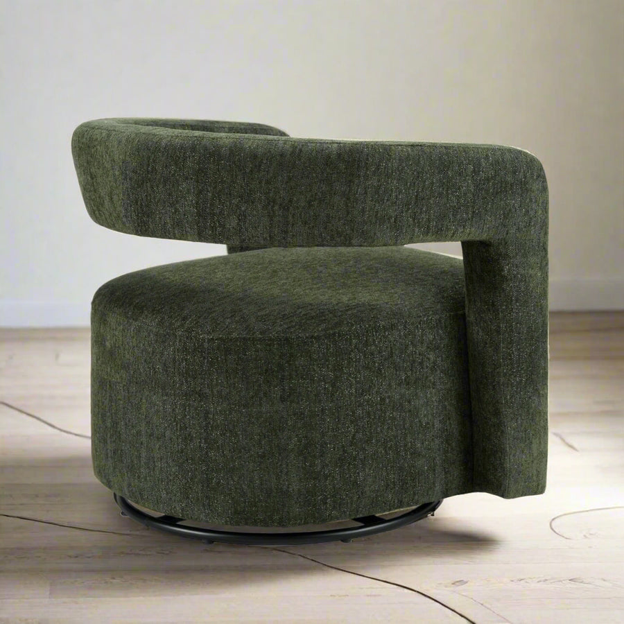Green upholstered chair with a round base on a white background