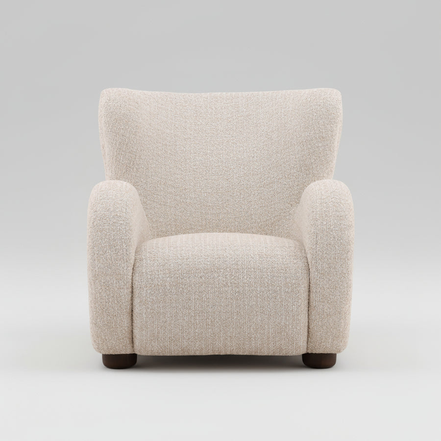 front view of a beige armchair