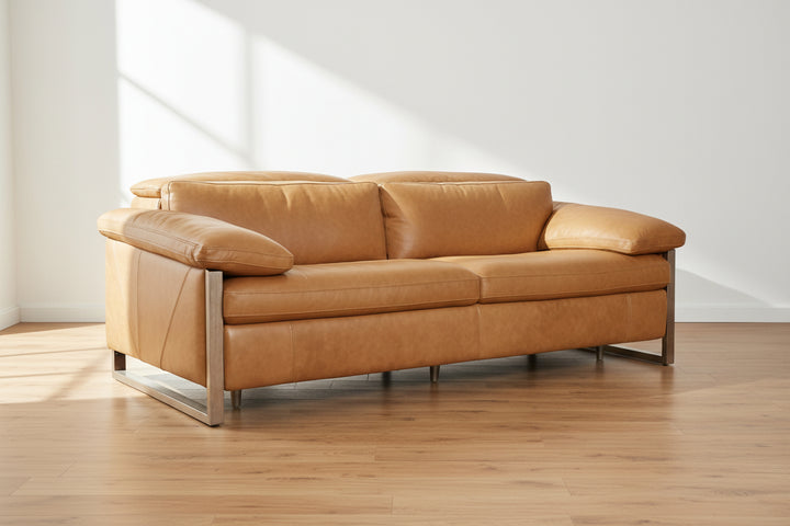tan leather sofa, two-seater, plush cushions, wood legs, minimalist design, clean lines, modern aesthetic, neutral background, comfortable seating, contemporary furniture