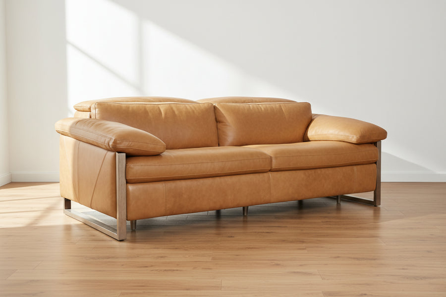 tan leather sofa, two-seater, plush cushions, wood legs, minimalist design, clean lines, modern aesthetic, neutral background, comfortable seating, contemporary furniture
