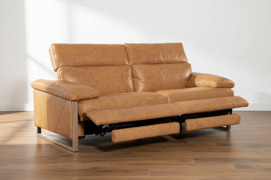 tan leather reclining sofa, two-seater, extended footrests, wooden legs, plush cushions, contemporary living room furniture, adjustable seating, comfortable design, neutral tone, spacious armrests