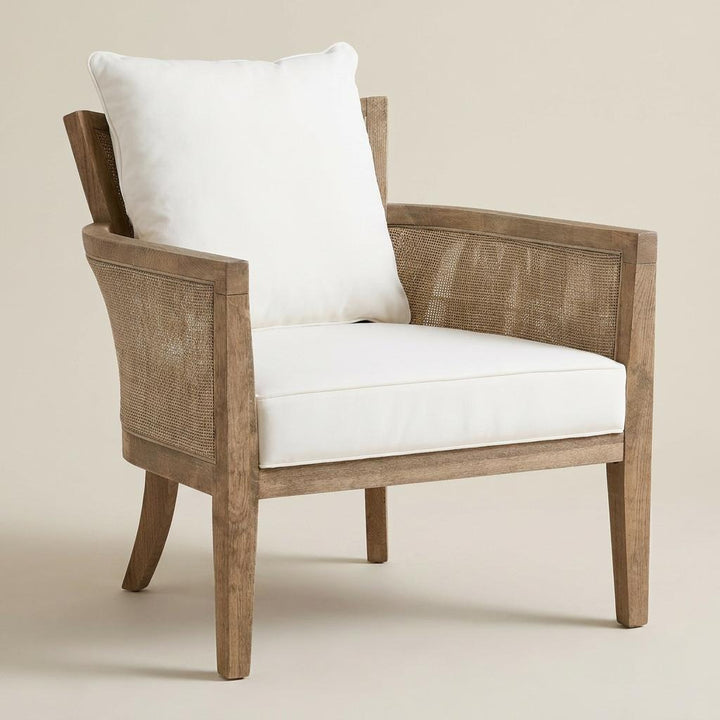 Wooden armchair with white cushion on a beige background