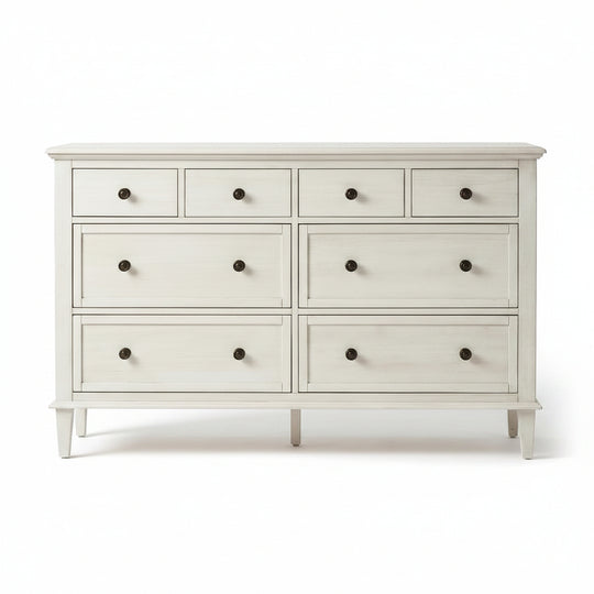 White dresser with multiple drawers on a white background
