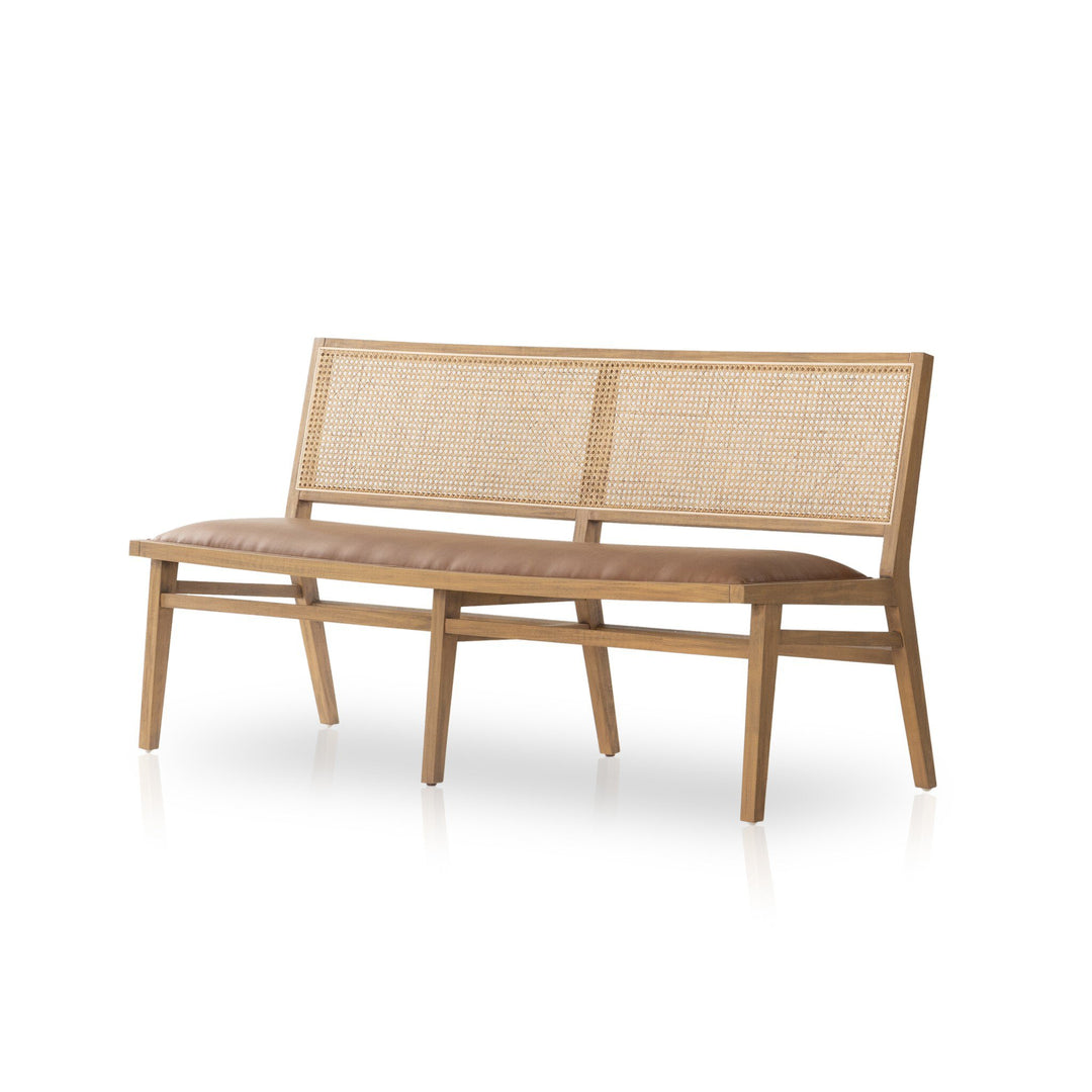 A stylish wooden bench with a caned backrest and a cushioned seat, ideal for modern interiors or outdoor spaces.