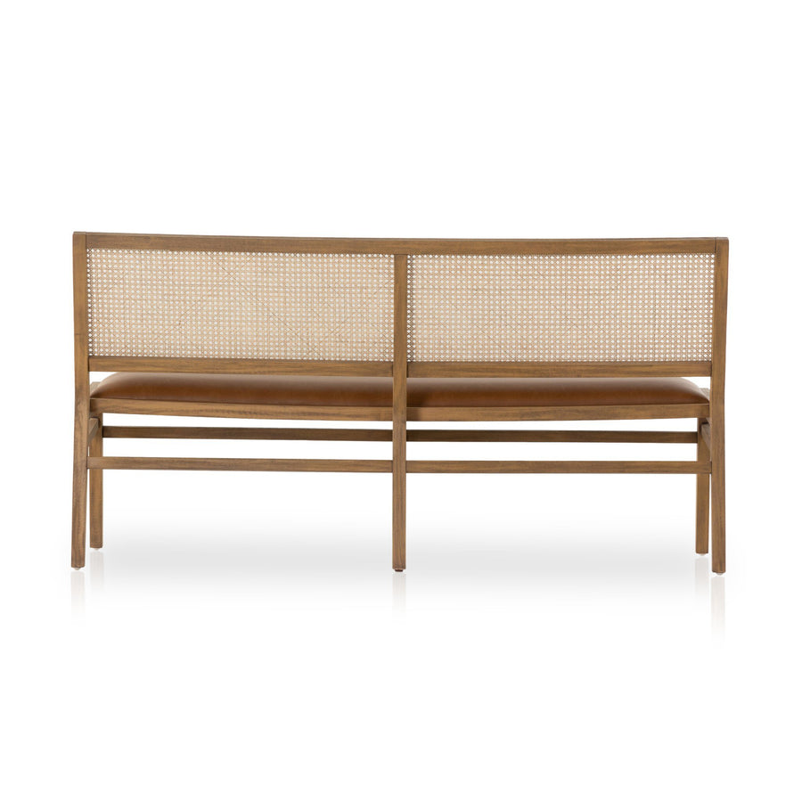 Back view of a modern wooden bench featuring a woven cane backrest and a cushioned seat in warm brown tone.