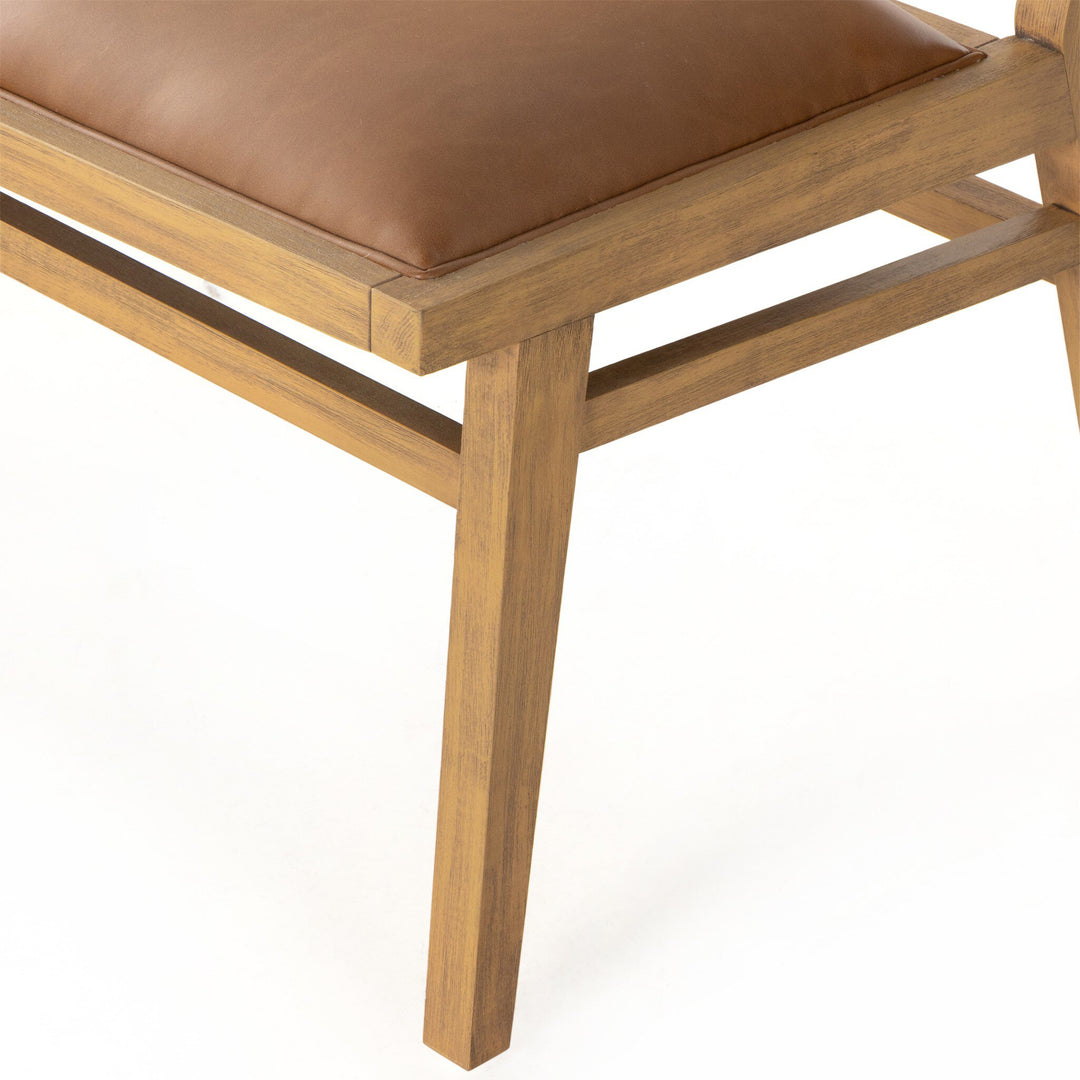 Close-up of a wooden bench frame with a brown padded seat, showcasing clean lines and a modern design.