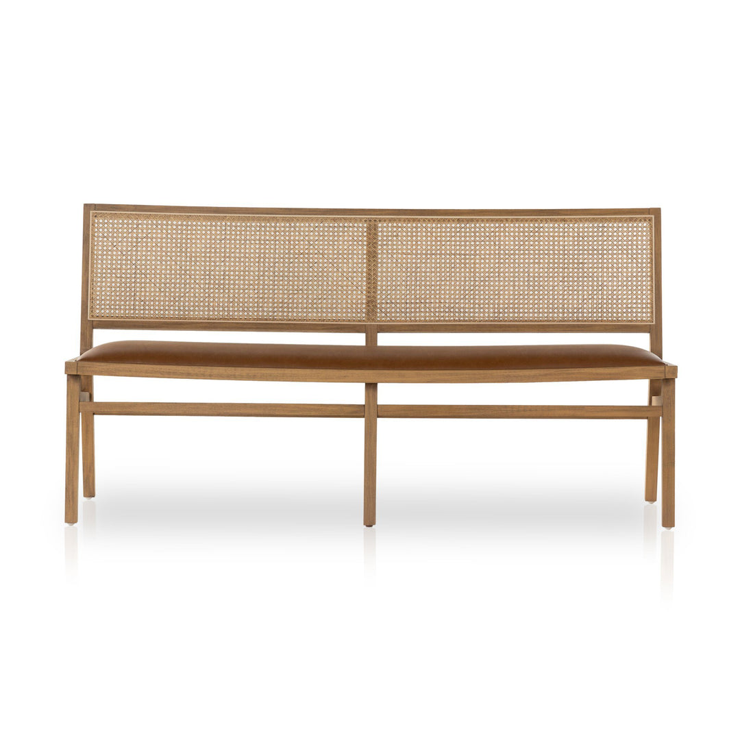 A modern wooden bench featuring a woven cane backrest and a cushioned seat in warm brown tones, set against a white background.