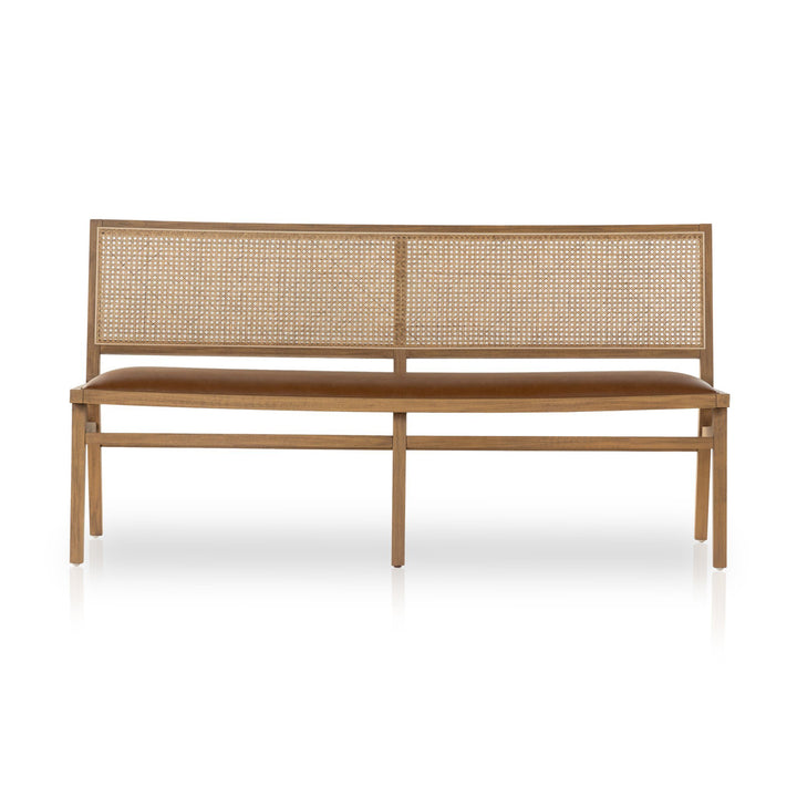 A modern wooden bench featuring a woven cane backrest and a cushioned seat in warm brown tones, set against a white background.