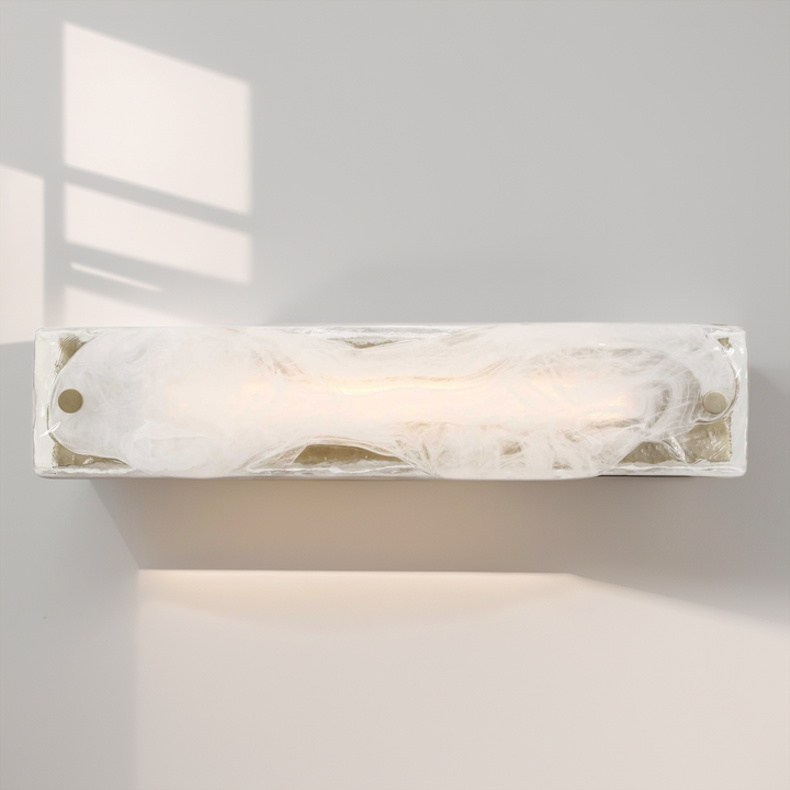 Wall-mounted light fixture with marble-like finish on a neutral background