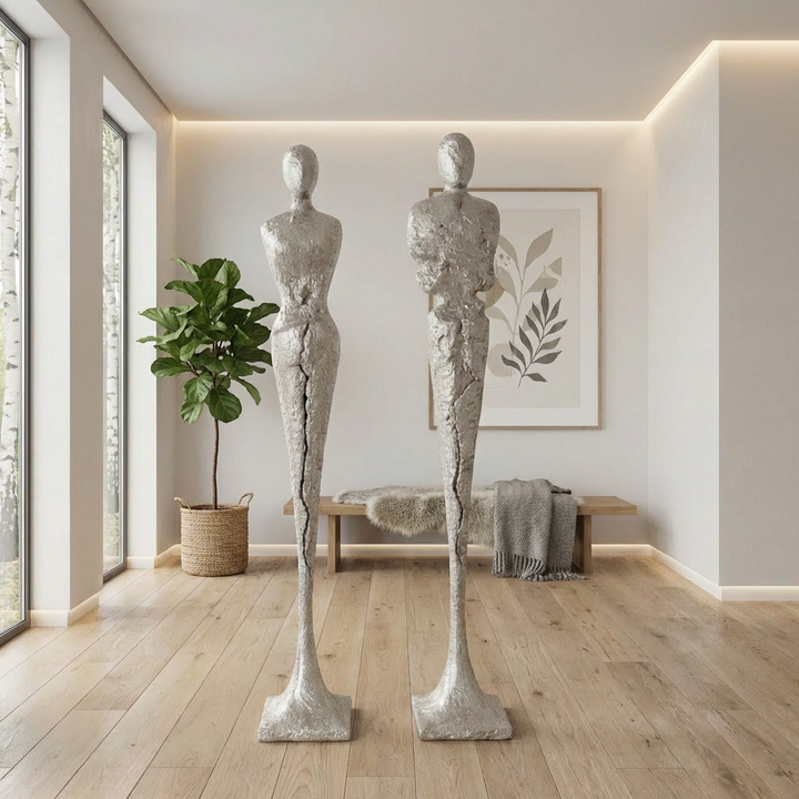 TALL CHISELED SILVER LEAF MALE & FEMALE SCULPTURES