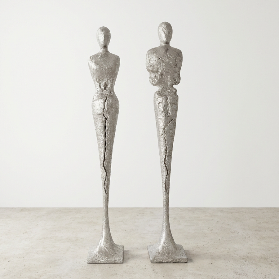 TALL CHISELED SILVER LEAF MALE & FEMALE SCULPTURES