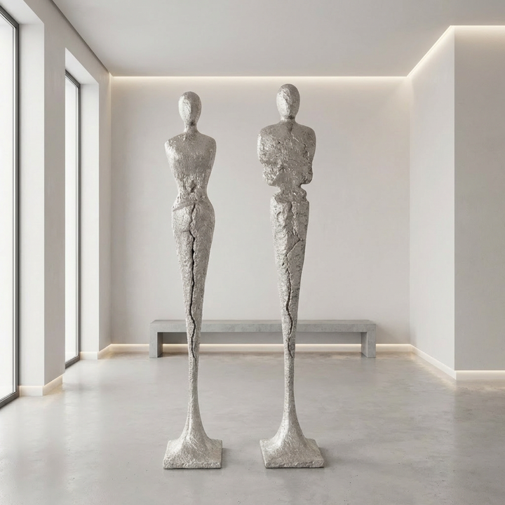 TALL CHISELED SILVER LEAF MALE & FEMALE SCULPTURES