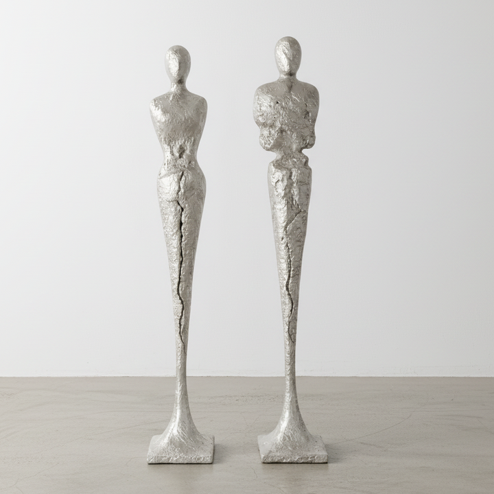 TALL CHISELED SILVER LEAF MALE & FEMALE SCULPTURES