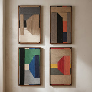 Four framed abstract wall art pieces arranged in a 2x2 grid on a warm beige wall. Each piece features geometric shapes and textured vertical ribbed patterns in earthy tones, with one including green, blue, and red accents.