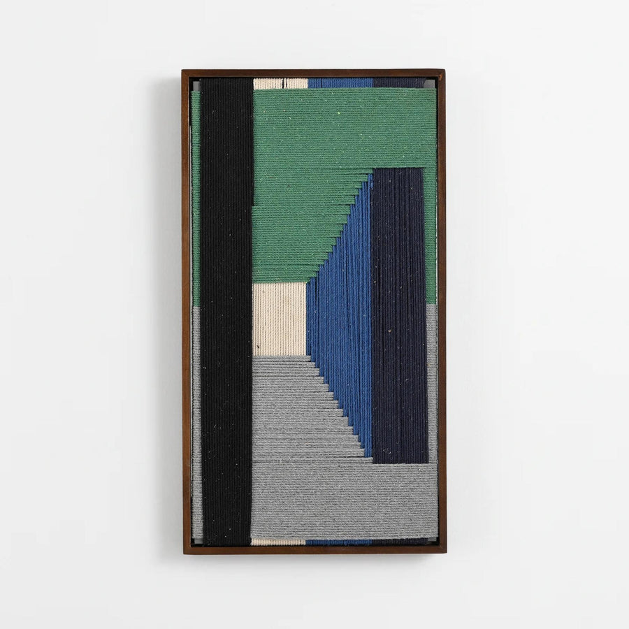 A framed abstract textile wall art piece featuring vertical and geometric woven bands