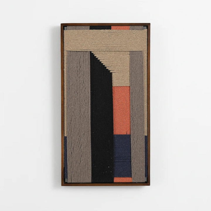 A framed abstract textile wall art piece featuring vertical and geometric woven bands