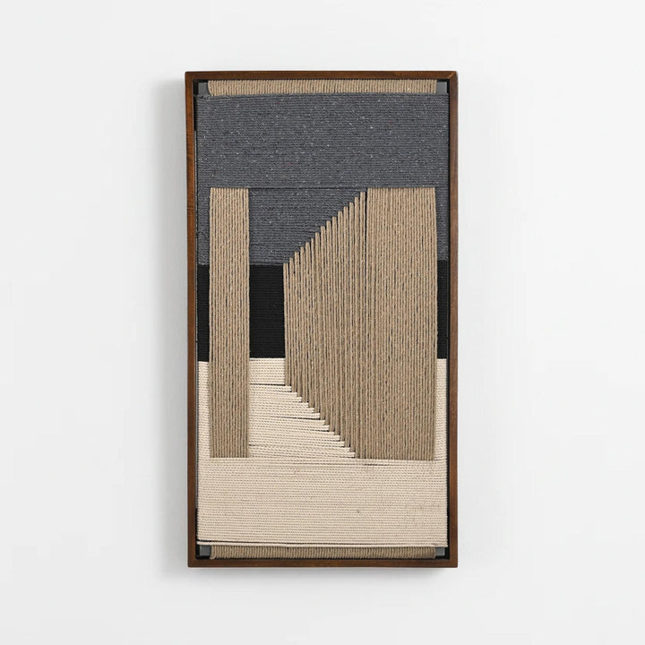A framed abstract textile wall art piece featuring vertical and geometric woven bands