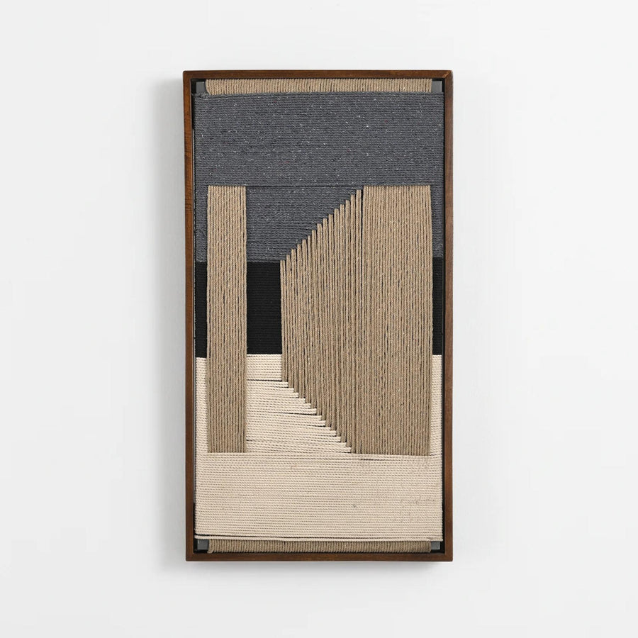 A framed abstract textile wall art piece featuring vertical and geometric woven bands