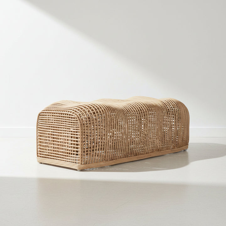 Woven rattan bench on a white background