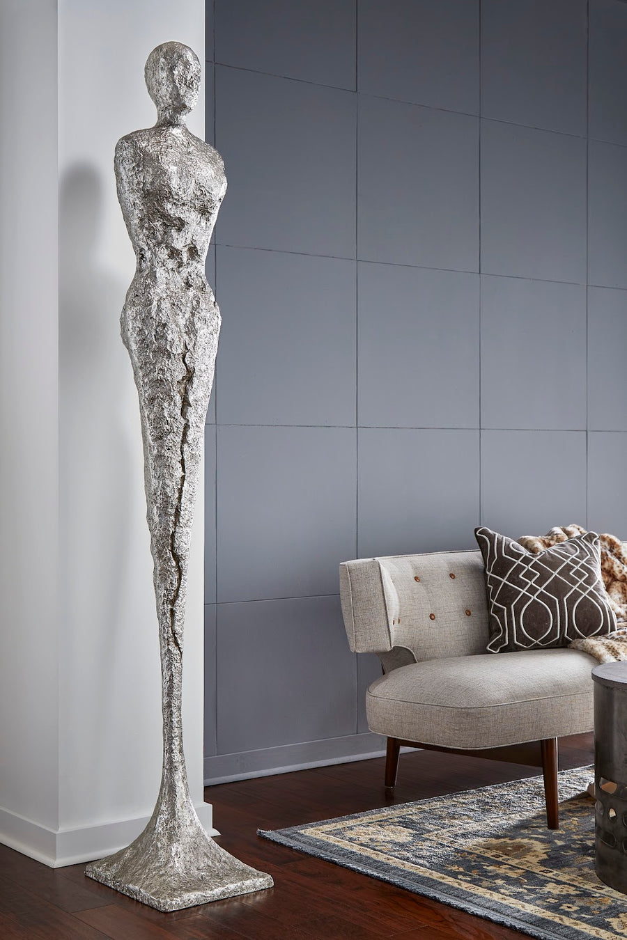TALL CHISELED SILVER LEAF MALE & FEMALE SCULPTURES