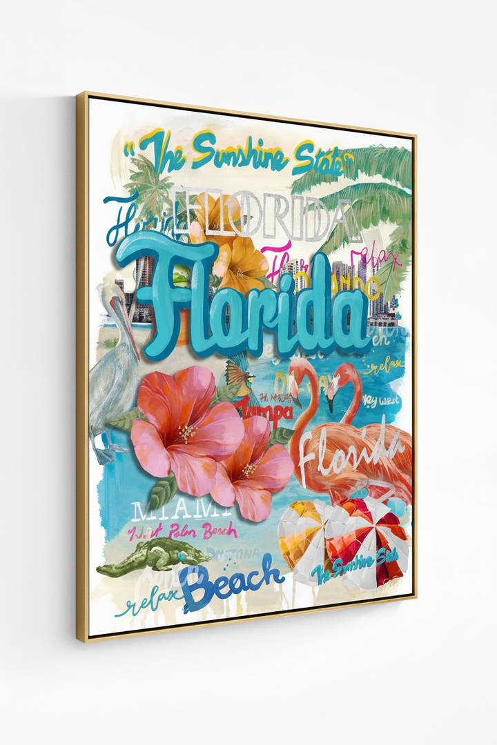 A framed Florida-themed collage art print featuring large turquoise 'Florida' lettering, pink hibiscus flowers, palm leaves, beach umbrellas, flamingos, a pelican, and tropical text elements, shown hanging on a light gray wall.