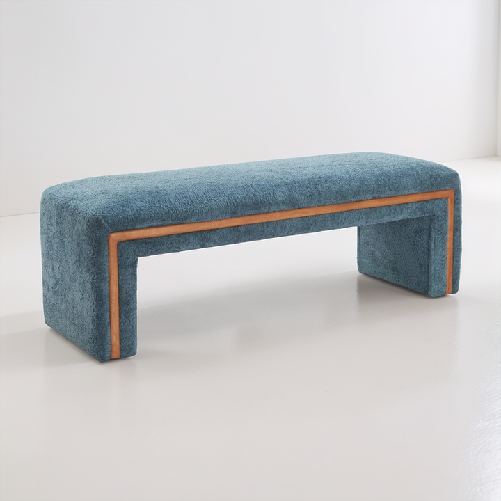 Blue upholstered bench with wooden frame on a white background