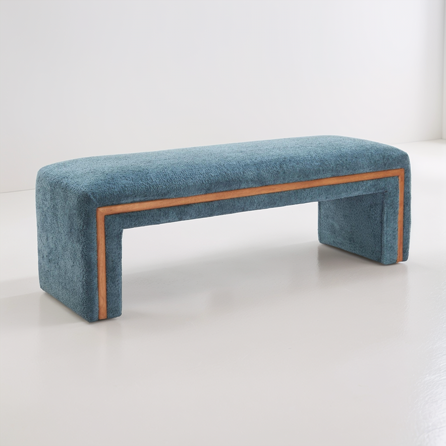 Blue upholstered bench with wooden frame on a white background