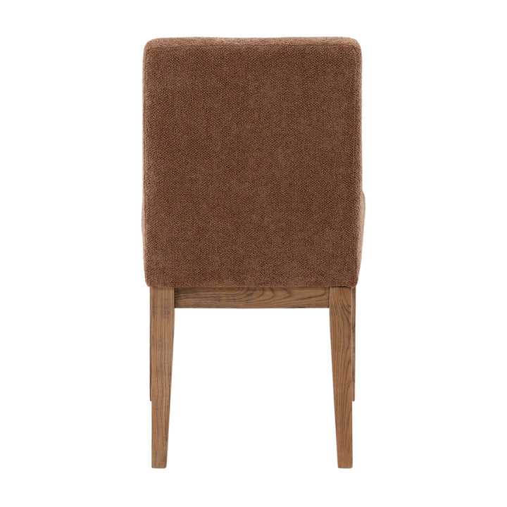 Brown upholstered chair with wooden legs on a white background