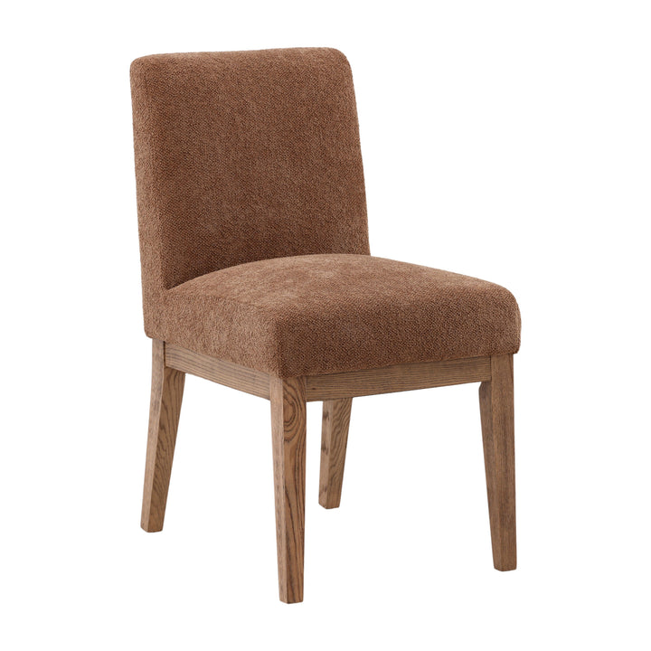 Brown upholstered chair on a wooden floor with a neutral background