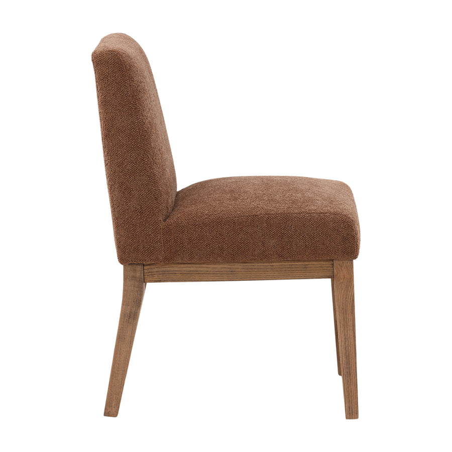 Brown upholstered chair with wooden legs on a white background