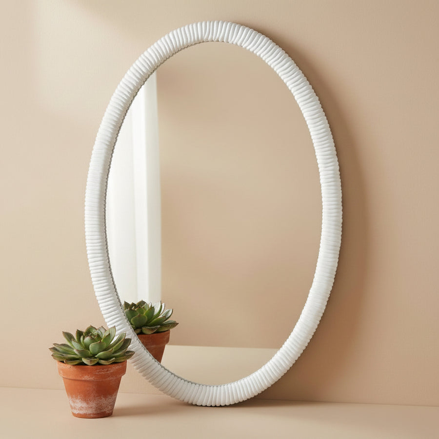White oval mirror with ribbed frame