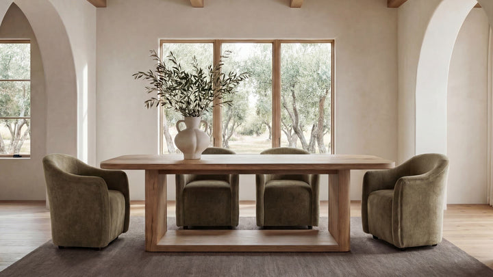Dining room with wooden table and chairs in a bright, naturally lit room.