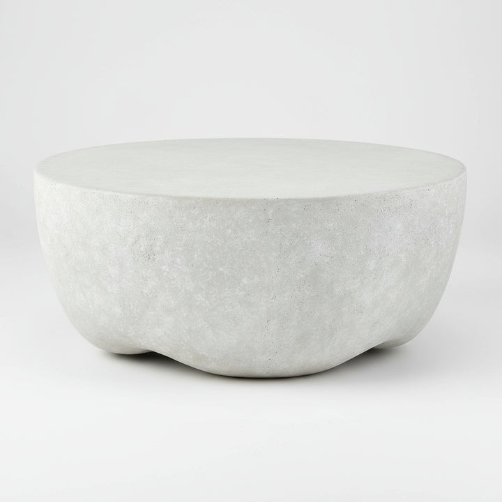 concrete coffee table on a concrete floor with a neutral background