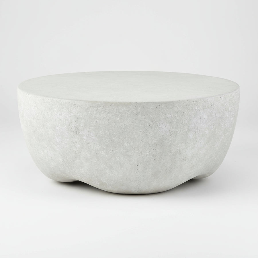 concrete coffee table on a concrete floor with a neutral background