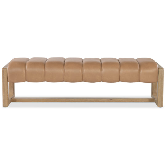 A stylish, tan leather bench with tufted seating and a light wooden frame, perfect for modern living spaces.