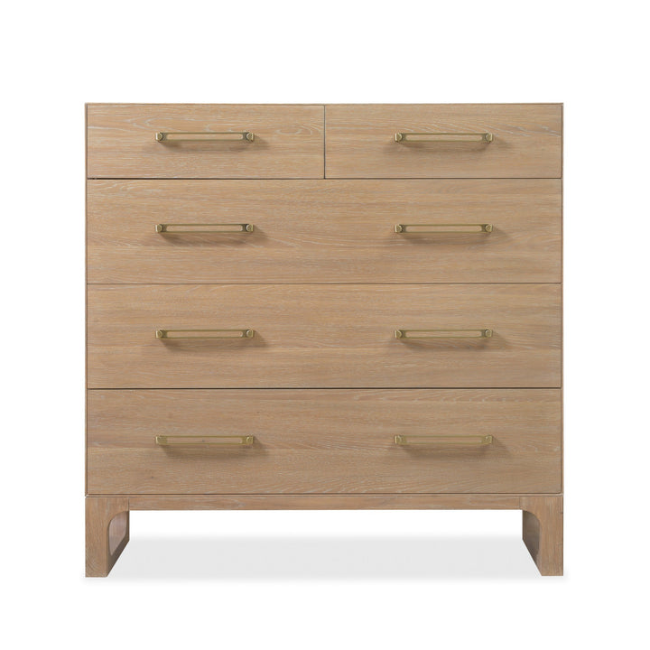 Wooden dresser with a light oak finish, five drawers, and brass handles.