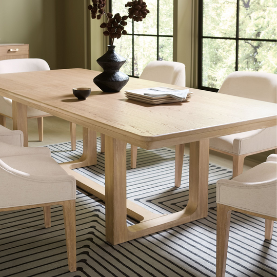 Wooden extension dining table with a natural finish and sturdy, classic design.