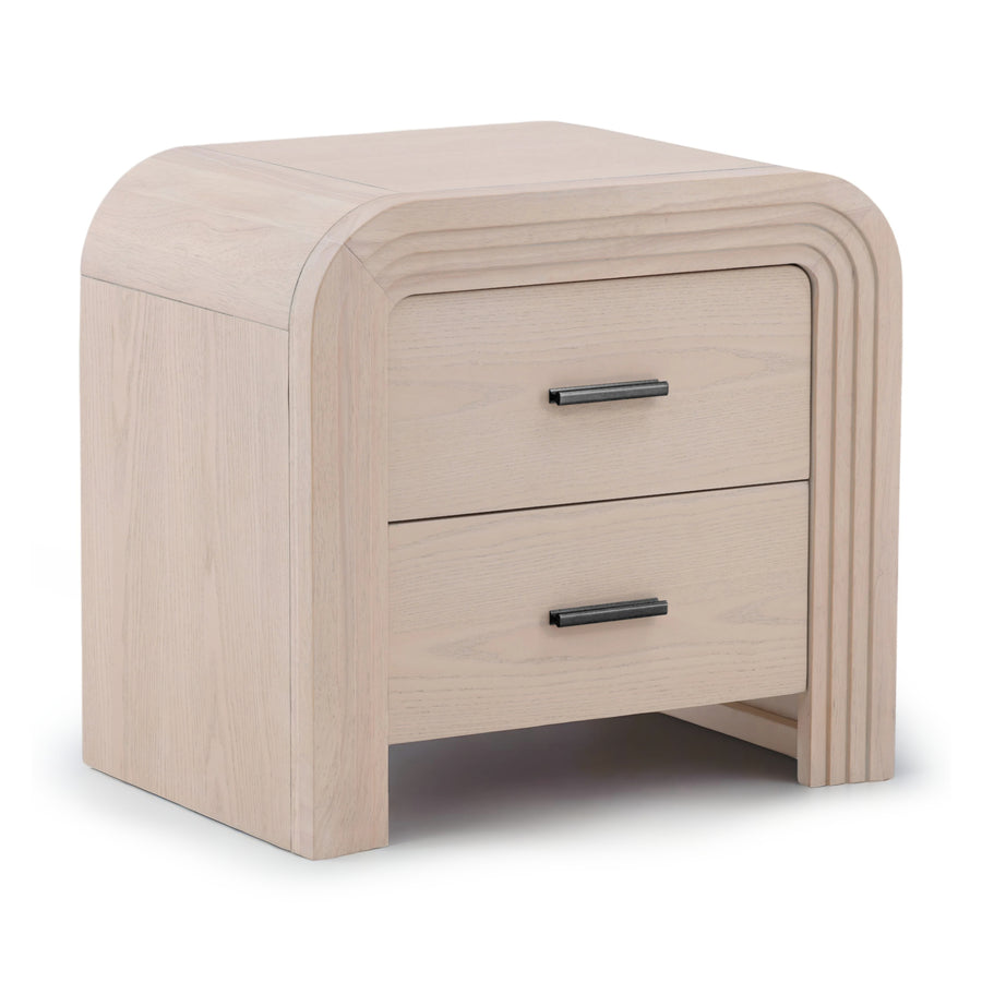 Light-colored wooden nightstand with rounded edges and two drawers, featuring sleek black handles.