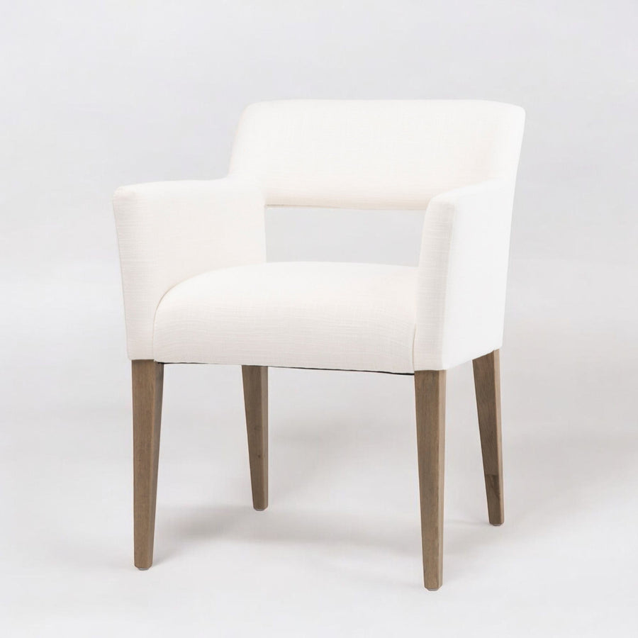 White chair with wooden legs on a white background