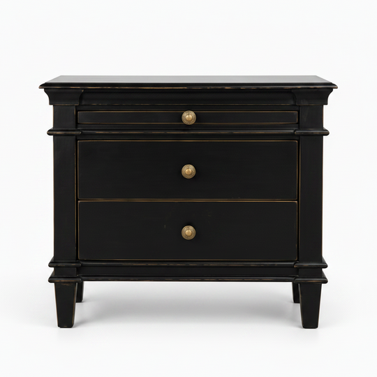 A black three-drawer nightstand with brass-finished round knobs and subtle gold-toned trim, photographed against a clean white background.