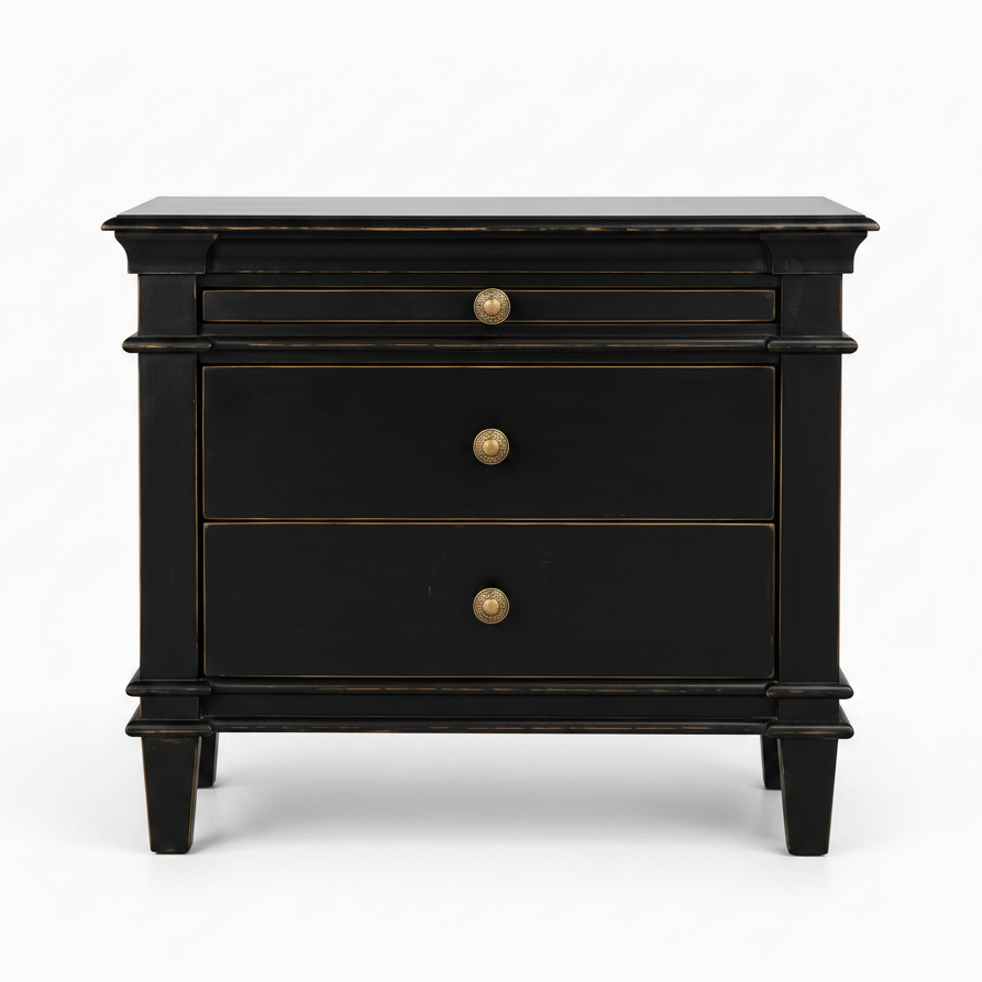 A black three-drawer nightstand with brass-finished round knobs and subtle gold-toned trim, photographed against a clean white background.