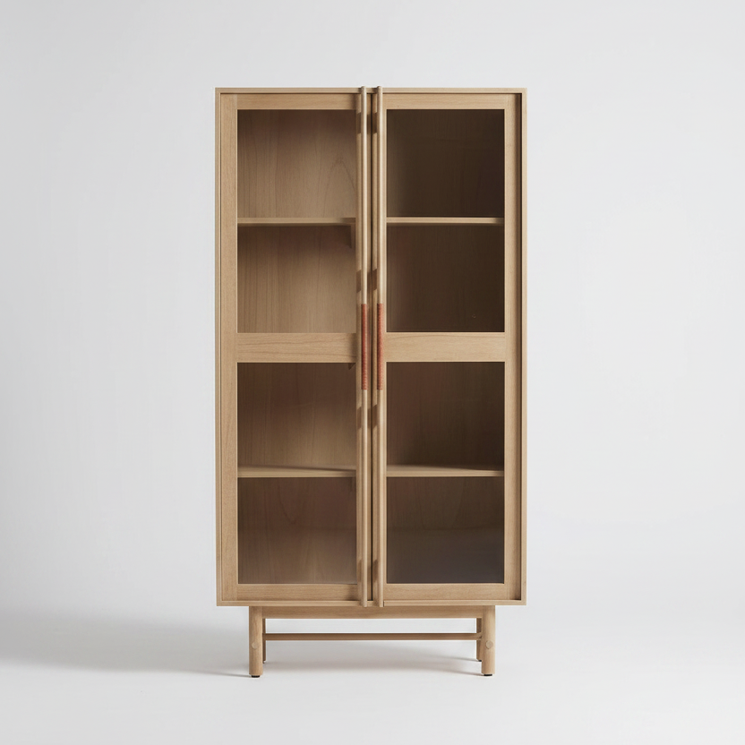 Wooden cabinet with glass doors on a studio white background