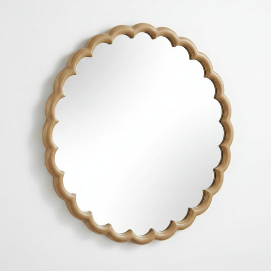 Round mirror with a decorative beige wooden frame on a white background