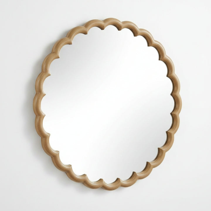 Round mirror with a decorative beige wooden frame on a white background